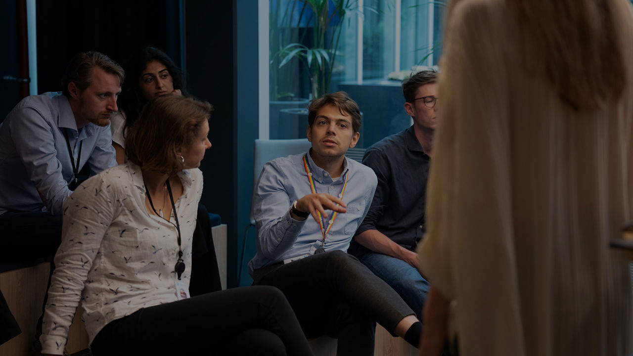 Man listening to a team conversation